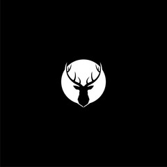 Silhouette of a deer head and antlers icon isolated on dark background