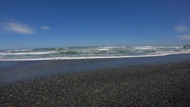 Beach in the south of Chile, Patagonia, where the waves show how is the Pacific Ocean.