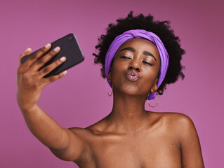 Phone, selfie and face of black woman for beauty, body wellness and fashion on purple background. Cosmetics, skincare and happy girl influencer on smartphone for social media, picture and online post