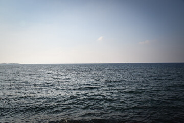 Blue ocean with waves. Sunny day on the water.