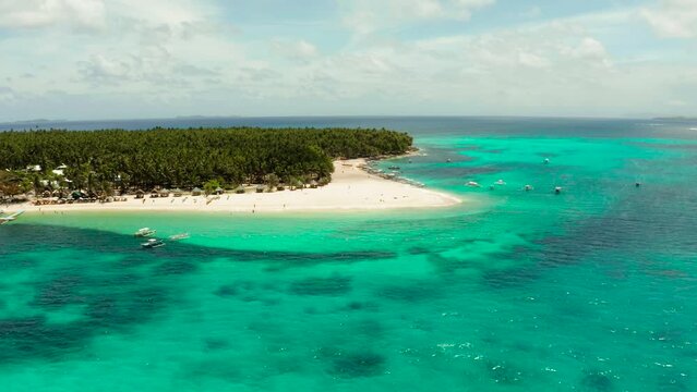 Travel concept: sandy beach on a tropical island by coral reef atoll from above. Daco island, Philippines. Summer and travel vacation concept
