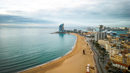 Fototapeta na wymiar Aerial view of Barceloneta district and Beach front in Barcelona. View with the W hotel in the back