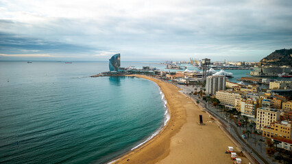Fototapeta na wymiar Aerial view of Barceloneta district and Beach front in Barcelona. View with the W hotel in the back