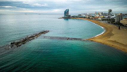 Aerial view of Barceloneta district and Beach front in Barcelona. View with the W hotel in the back