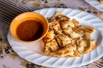 Close up minced meat curry served with crispy Roti. Popular Muslim food in southern Thailand