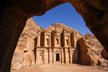 Ad Deir Monastery view from cave, famous carved temple in Petra historic city, Jordan