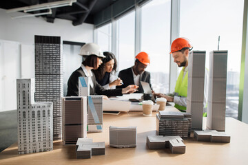 Focus on architecture design of buildings with residential project maquette, group of four...