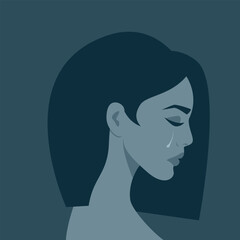 Portrait of a crying woman in grey blue tones. The concept of victim, resentment, depression.