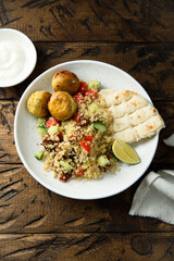 Falafel with warm couscous salad