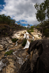 Waterfall scenery with vibrant rocks going through the jungle
