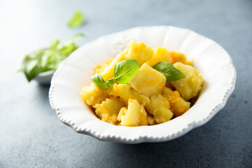 Braised potato with carrot and onion