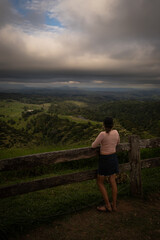 Lush Hilly view over a Valley With clouds rolling over