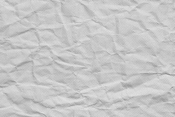 A sheet of gray crumpled dotted paper texture or background