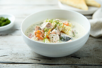 Traditional fish soup with vegetables and cream