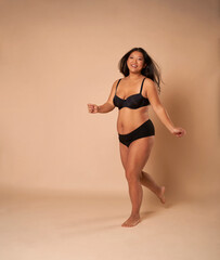 Cheerful Chinese woman in studio shot