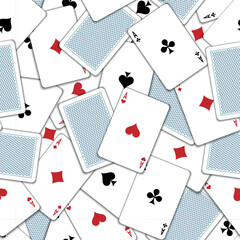 Pattern with playing cards. Playing cards scattered on the table. Suits of playing cards. Spades, Hearts, Clubs, Diamonds.