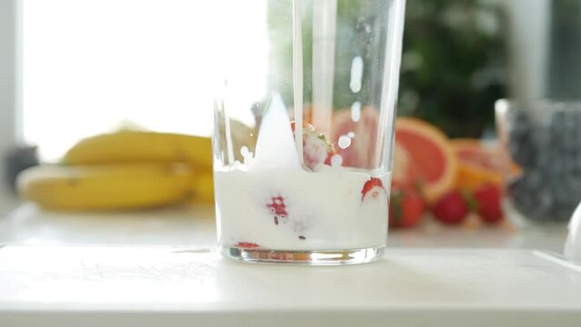 Pouring Milk in Glass, Preparing Strawberry Milkshake in Kitchen, Fresh Fruits Cocktail Drinks Closeup