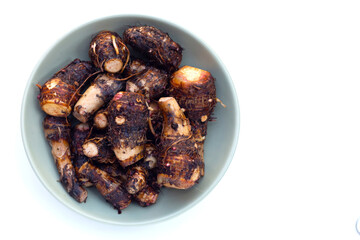 Organic taro fruit on white background.