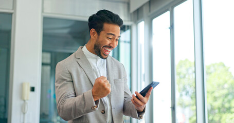 Fototapeta premium Success, phone and winner with businessman in office and celebration for deal, growth and stock market target. Wow, goals and good news with fist of employee for achievement, future and sale