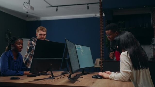 software testers team working in office, african and caucasian people, diverse and multiethnic team