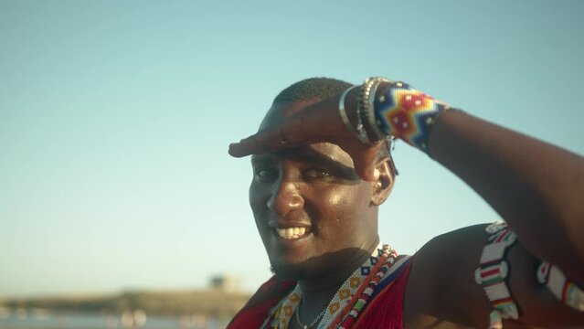 Portrait Of A Courageous Masai Warrior With Beaded Tribal Jewelry Near The Beach In Watamu, Kenya. Close up