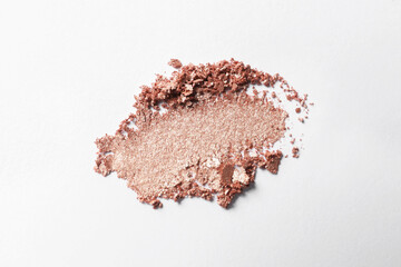 Crushed eye shadow on white background, top view. Professional makeup product