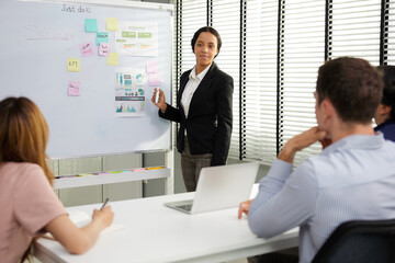 businesspeople team meeting or seminar. and presentation about work project on whiteboard