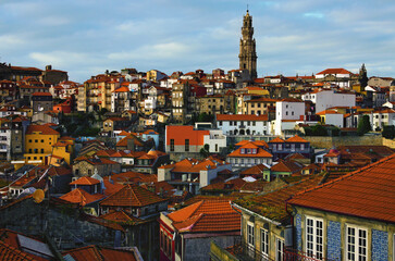 Picturesque aerial landscape view of traditional ancient colorful buildings with red tile roofs in Ribeira district in Porto old town. Travel and tourism concept. UNESCO World Heritage Site