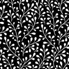 Pattern with leaves, white branches on a black background. Decorative, abstract. Suitable for curtains, wallpapers, fabrics, tiles, wrapping paper.