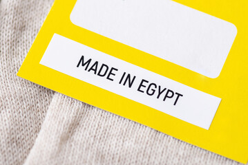 Close up on label on socks with inscription Made in Egypt. Making clothes in Egypt concept