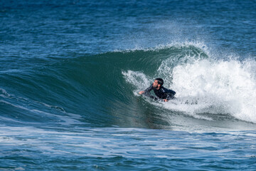 Bodyboarder surfing ocean wave
