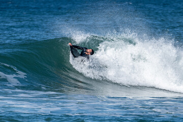 Bodyboarder surfing ocean wave