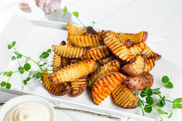 Baked potato slices on a light background