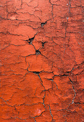 Red Cracked surface background. Distressed background, cracked wall texture