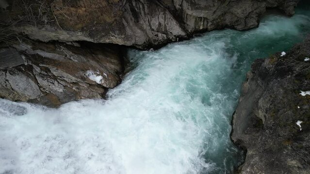 the lech fall near f&uuml;ssen in bavaria in the alps where a lot of water flows into the valley and the water flows back and forth between the rock walls recorded with a drone