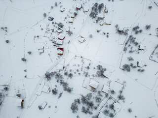 Winter Landscape with Small Village Houses Between Snow Covered Forest in Cold Mountains. Giresun - Turkey