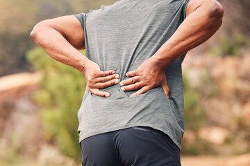 Man with back pain, sport injury and outdoor hiking, spine and health, muscle tension and fitness...