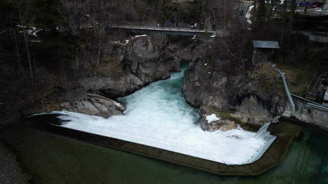 the lech fall near f&uuml;ssen in bavaria in the alps where a lot of water flows into the valley and the water flows back and forth between the rock walls recorded with a drone