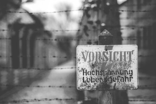 Poland, Auschwitz - April 18, 2014: Warning sign in the former concentration and extermination camp Auschwitz