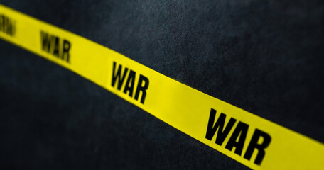 Yellow tape stripe with war text as warning stop millitary conflict. Concept of invasion, danger and truth