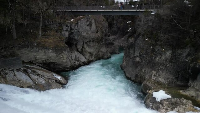 the lech fall near f&uuml;ssen in bavaria in the alps where a lot of water flows into the valley and the water flows back and forth between the rock walls recorded with a drone