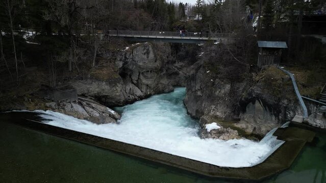 the lech fall near f&uuml;ssen in bavaria in the alps where a lot of water flows into the valley and the water flows back and forth between the rock walls recorded with a drone