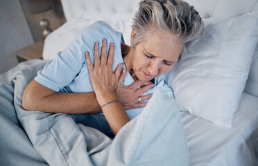 Heart attack, senior woman and chest pain, anxiety or medical emergency in her bedroom. Heartburn, stress or stoke of elderly person cardiology, breathing and lung problem with healthcare risk - obrazy, fototapety, plakaty