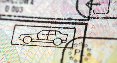 International travel visa passport stamp. Close up macro detail of European Union border control customs admission stamps with car symbol