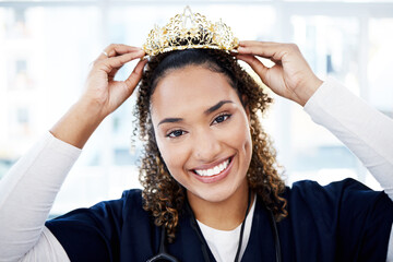 Portrait, crown or healthcare and a black woman nurse standing in a hospital with a proud smile....