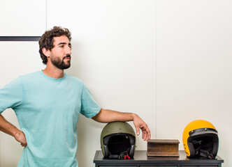 young adult crazy man with expressive pose at a modern house interior