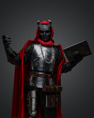 Portrait of evil knight with book dressed in red robe and plate armor.