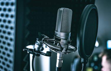 Professional microphone in recording studio for music creation closeup. Mic for rock and pop vocal presentation