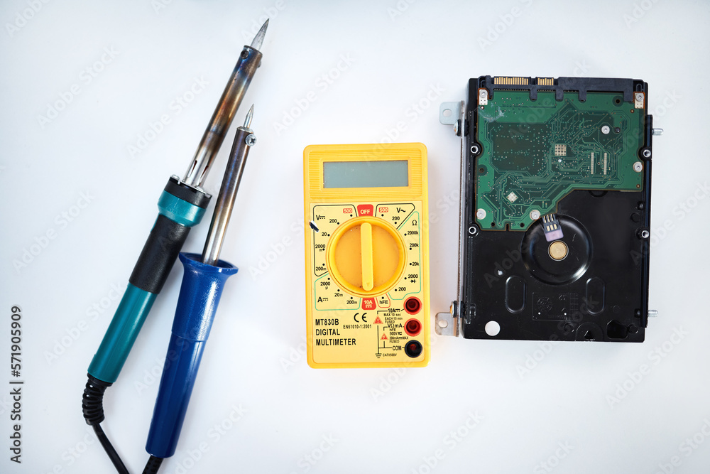 Poster Tools to fix computer parts, hard drive and isolated on white background, technology and engineering in repair workshop. Hardware maintenance, problem diagnosis and machine assembly in empty studio.