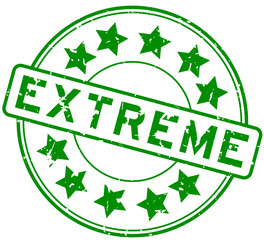 Grunge green extreme word with star icon round rubber seal stamp on white background